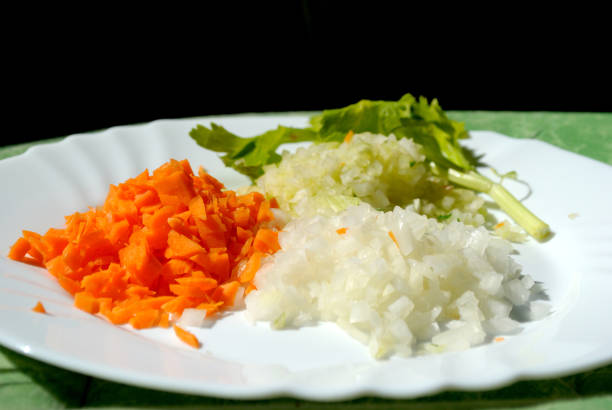 Brunoise onions, carrots and celery in a plate stock photo