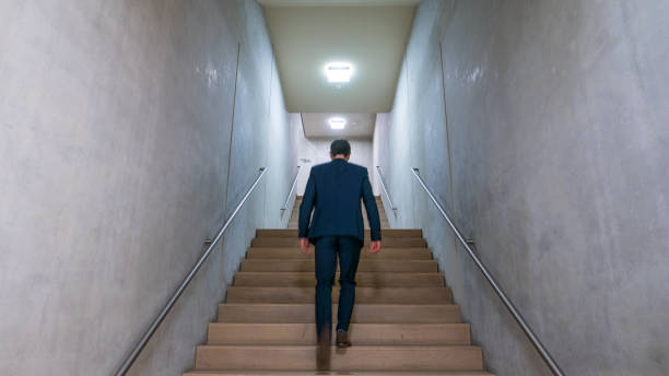 istock A man in a blue suit goes upstairs 687920972