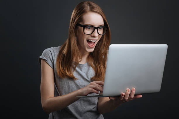 istock Positive energetic girl using social media 687923416