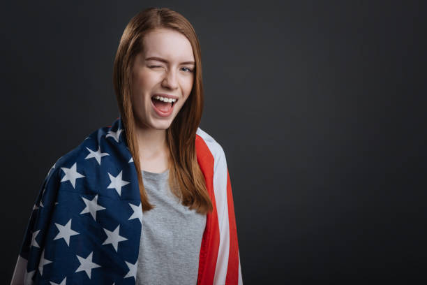 istock Adorable enchanting woman winking with her eye 687923692