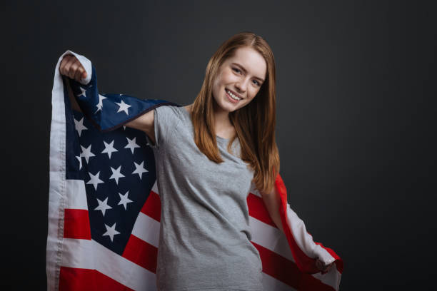istock Confident loyal woman posing with national flag 687923744