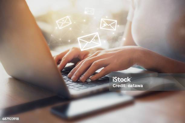 Woman Using Laptop With Email Icon Stock Photo - Download Image Now - E-Mail, Women, Send