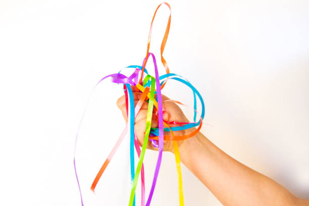 istock child holding a colorful ribbons on a white background 687924198