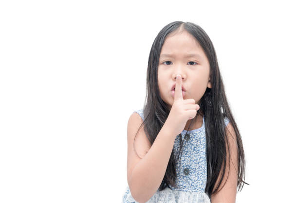 istock girl showing hand quiet silence sign gesture 687928932