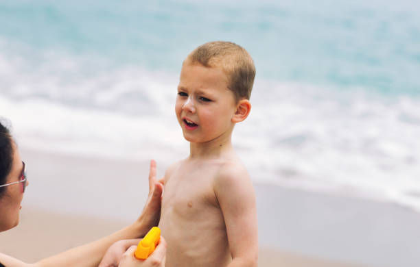 istock Mother applying sunscreen to her child 687928996