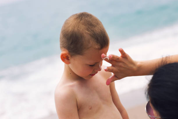 istock Mother applying sunscreen to her child 687929024