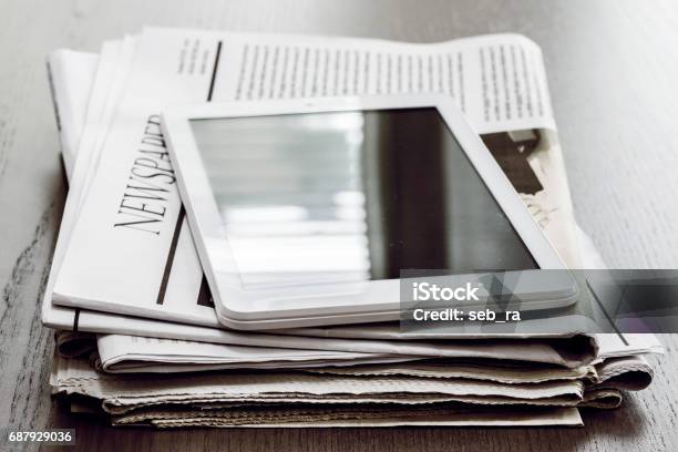 Newspaper And Digital Tablet On Wooden Table Stock Photo - Download Image Now - Newspaper, The Media, Digital Tablet