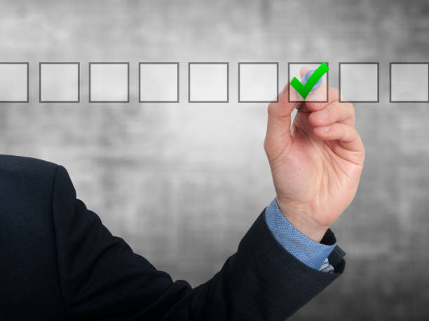 istock Businessman checking mark checklist marker Isolated on grey background 687929104