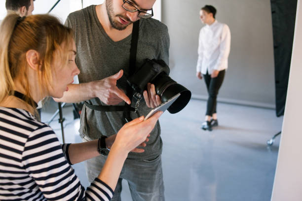 istock Photographer communicate with photoshoot director 687931952