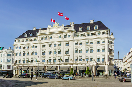 Flags on the facade of the Hotel D´angleterre in Copenhagen, Denmark - May 18, 2017