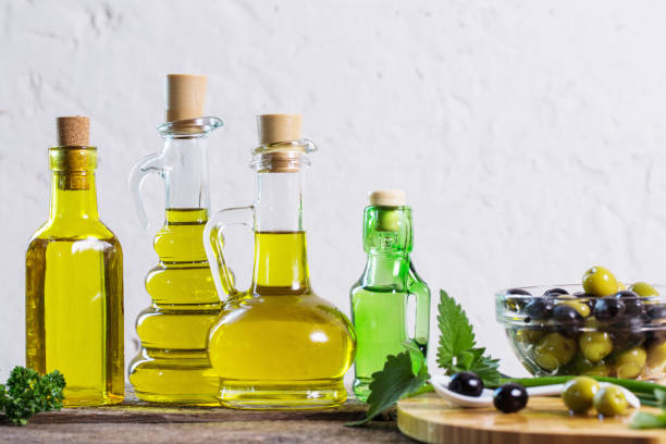 istock Olive oil  on the wooden table 687935510
