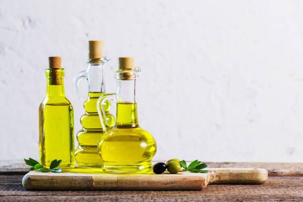 istock Olive oil  on the wooden table 687935538