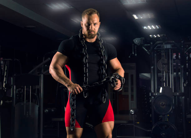 istock A strong athlete is wearing bench equipment with a chain around his neck 687939424