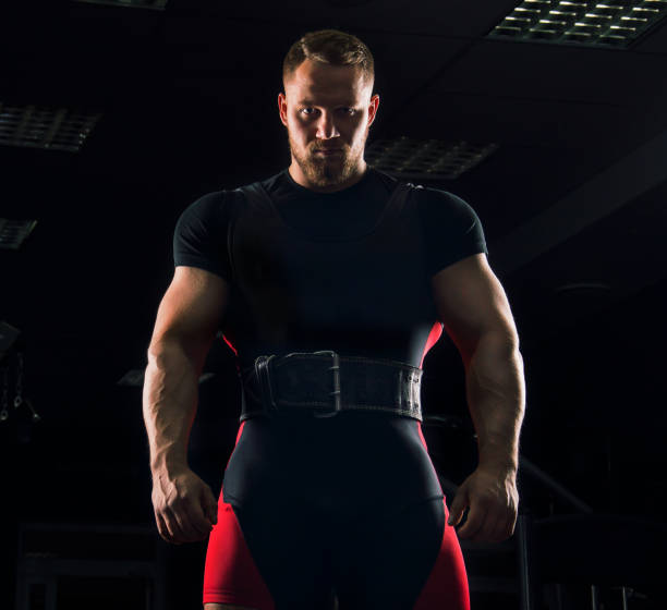 istock Handsome athlete is standing with a sports belt 687939452