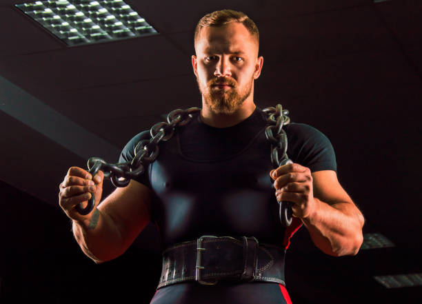 istock Huge weightlifter with a chain around his neck 687939486