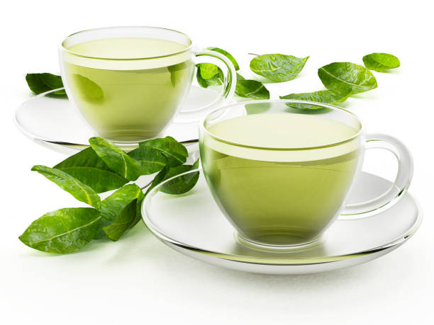 istock Glass cups with green tea and tea leaves isolated on white 687939676
