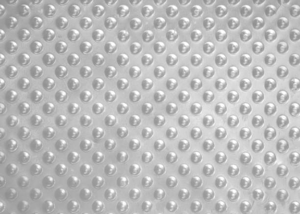 istock Abstract background of silver drops on a silver metal plate, 687943946