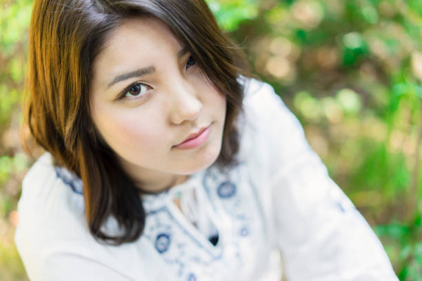 istock Young woman relaxing in outdoors. 687951256