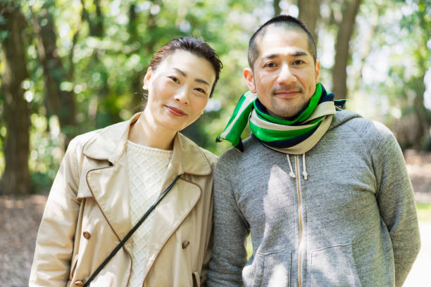 istock Asian couple having fun time in outdoors. 687951324