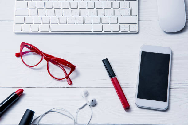 istock smartphone, keyboard and beauty supplies on table 687955066