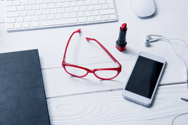 istock smartphone, keyboard and beauty supplies on table 687957670