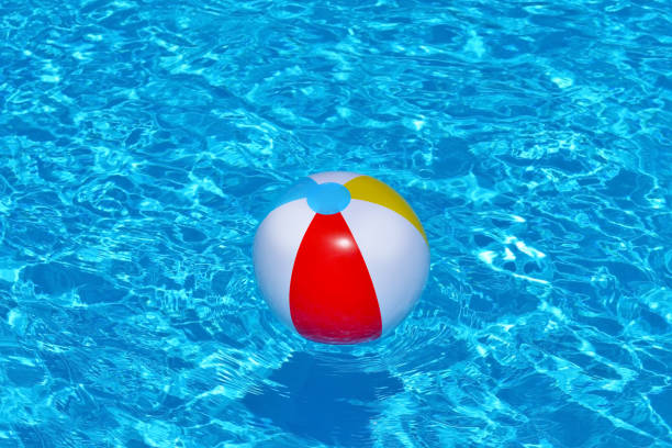 istock Colorful inflatable ball floating in swimming pool 687958254