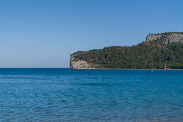istock Sailboat in front of shoreline 687958568