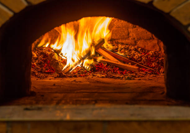 istock The fire burns in a wood pizza oven 687965100