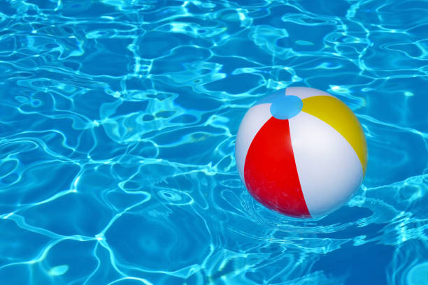 istock Colorful inflatable ball floating in swimming pool 687965148
