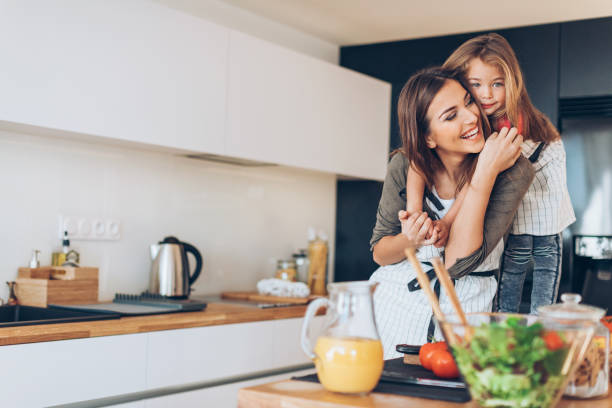 istock Loving mother and daughter in the kitchen 687965532