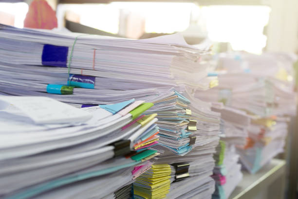 istock Pile of unfinished documents on office desk, Stack of business paper 687967836