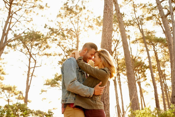 Shot of an affectionate young couple spending the day together in the woods