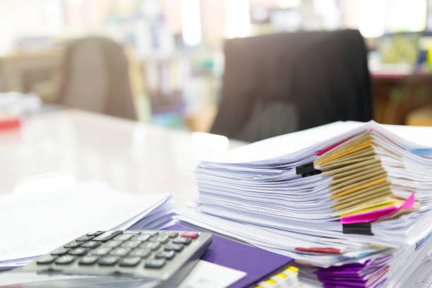 istock Pile of unfinished documents on office desk, Stack of business paper 687968050