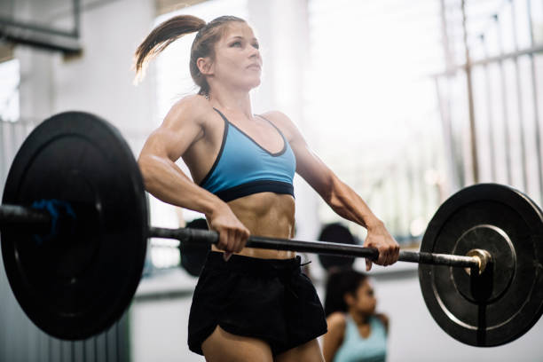 istock Strong woman doing Olympic lift 687968470