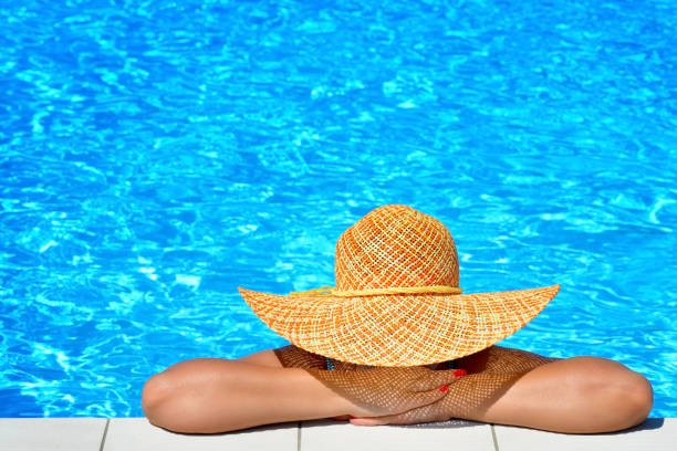 istock Real female beauty relaxing at swimming pool 687968732