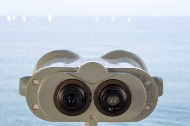 istock Binoculars Pointing Out to Sea and Sailing 687969280