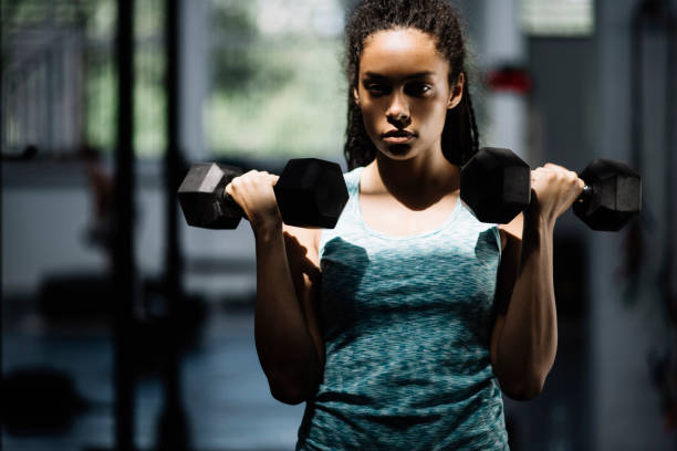 istock Woman doing arms exercises 687972382