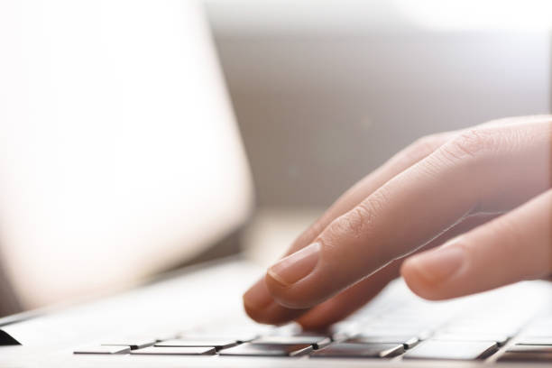 istock Hands typing on laptop keyboard close up 687973166