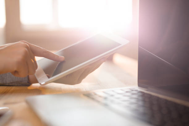 istock Hands pointing to tablet screen business set up 687973168
