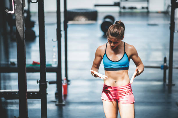istock Female athlete looking her hurting hands 687975306