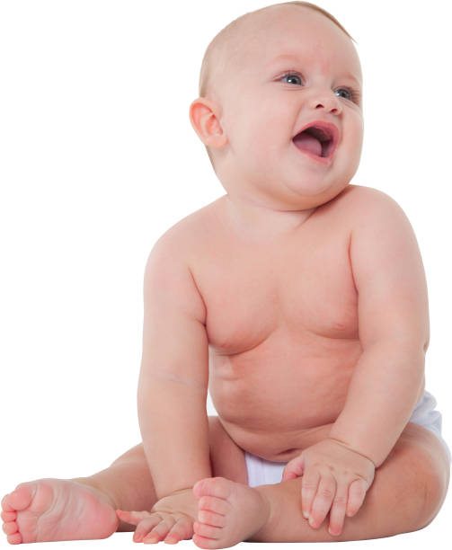 istock Cute baby boy in diaper looking away 687975512