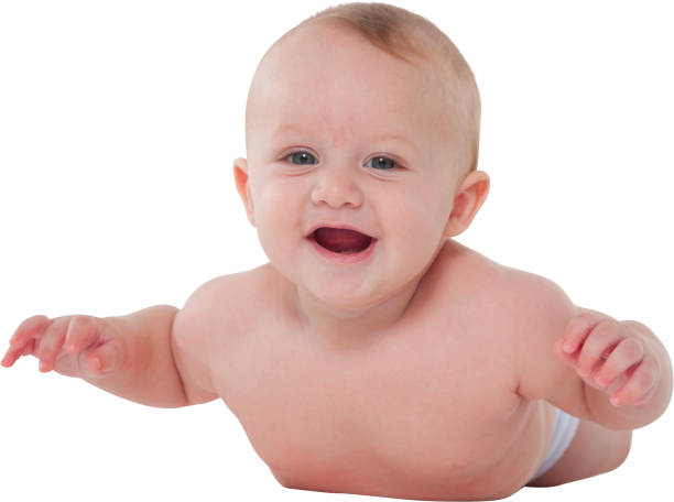 istock Cute baby boy smiling while lying on his tummy 687975514