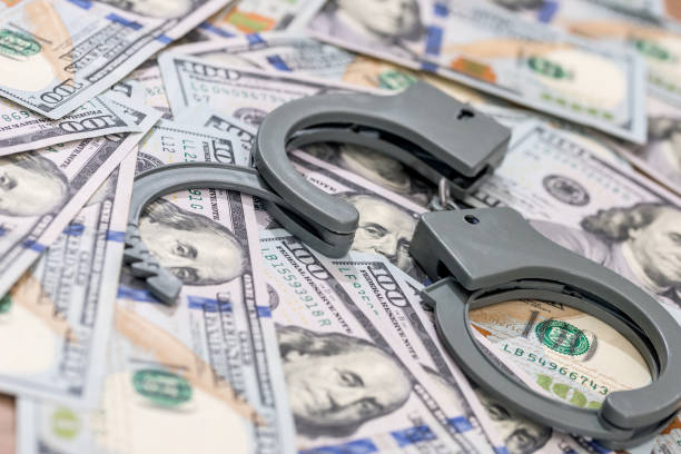 istock handcuff above usa dollar. close up . 687976178