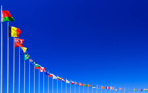 bandiere contro cielo blu - european culture europe national flag flag foto e immagini stock