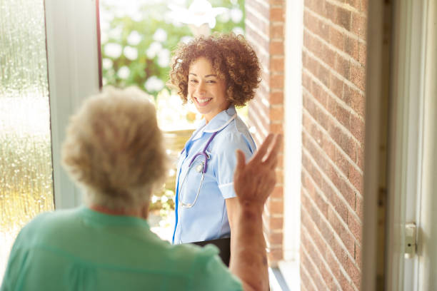 istock health visitor saying goodbye to patient 687976934