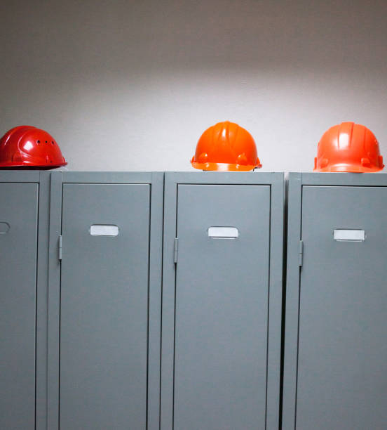 istock Metal lockers and plastic hard hats 687986552