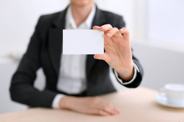 istock Business woman giving visit card 687987982