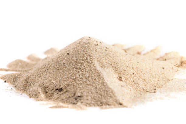 istock pile of sand isolated on white background, close up 687993448
