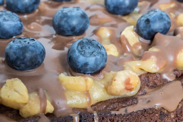 Chocolate tart with peanut caramel and blueberries.