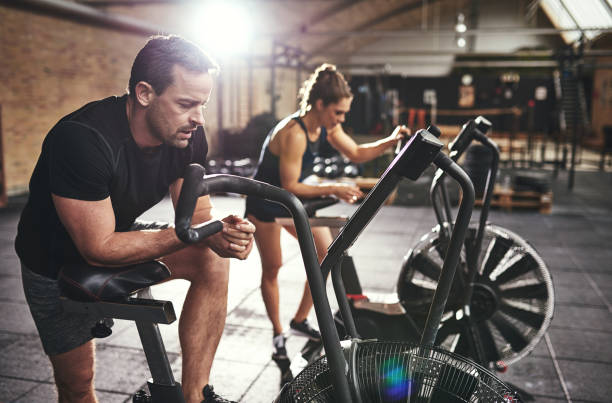 istock Young muscular sportspeople training on simulators 688002154
